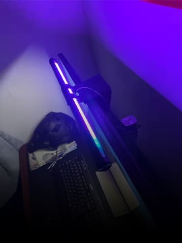 Striva Light Bar on a customer's monitor setup at night