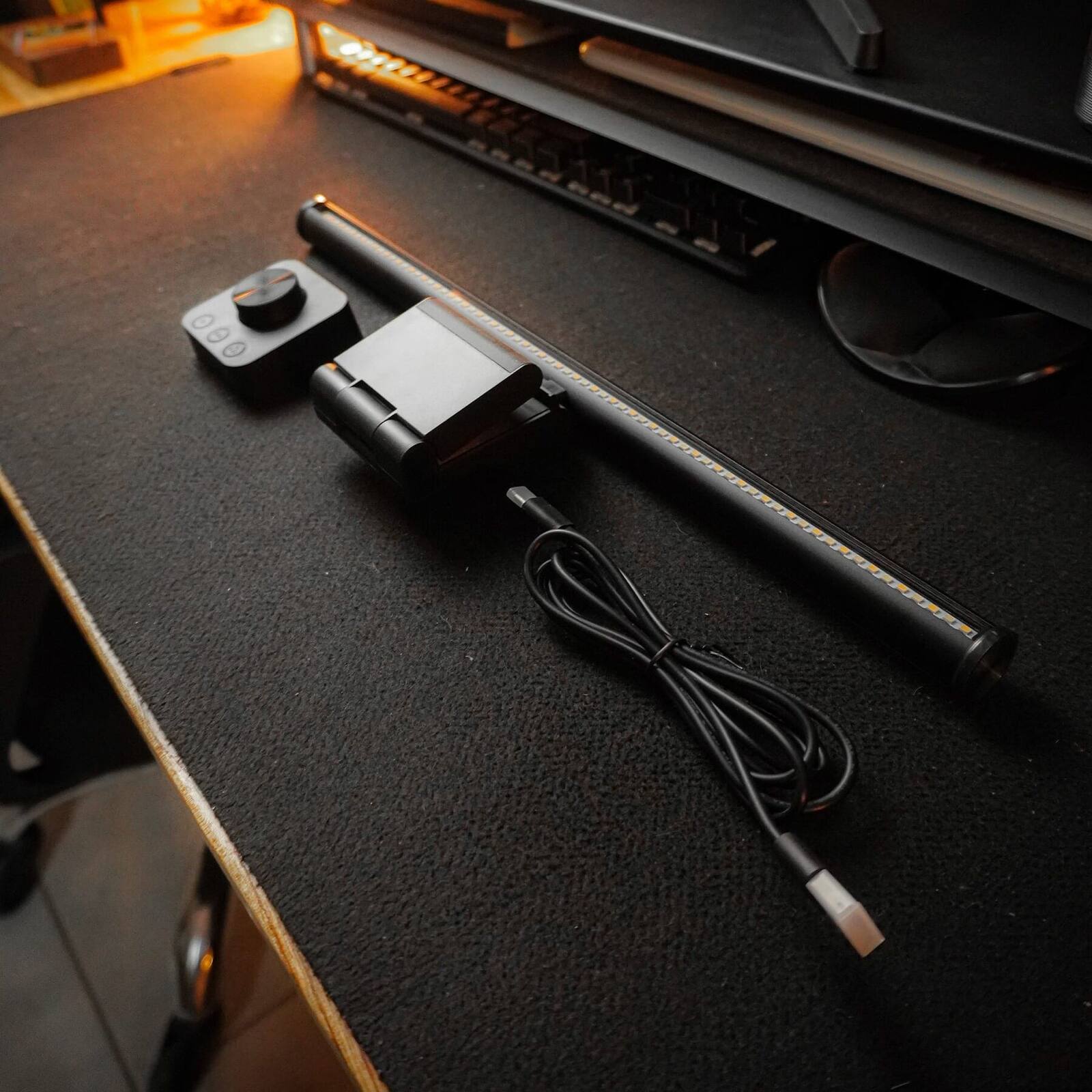 Striva Light Bar and its USB-C cable on a desk